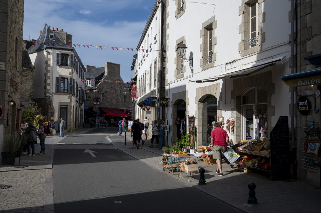 Man outside greengrocers in Roscoff, France