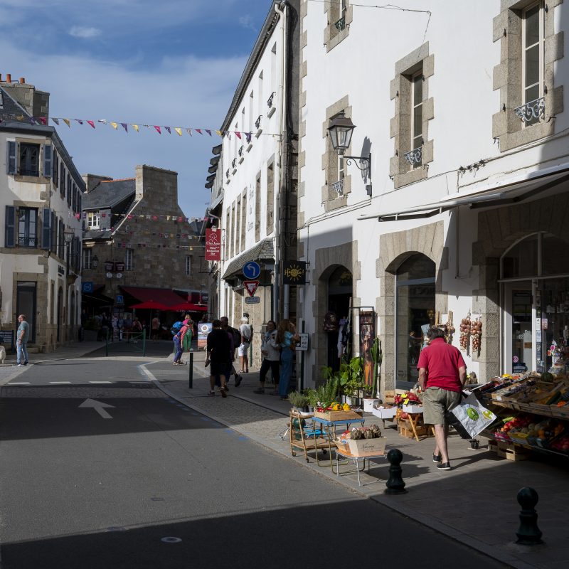 Man outside greengrocers in Roscoff, France